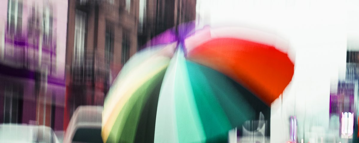 street in a rainy day reflection blur umbrella
