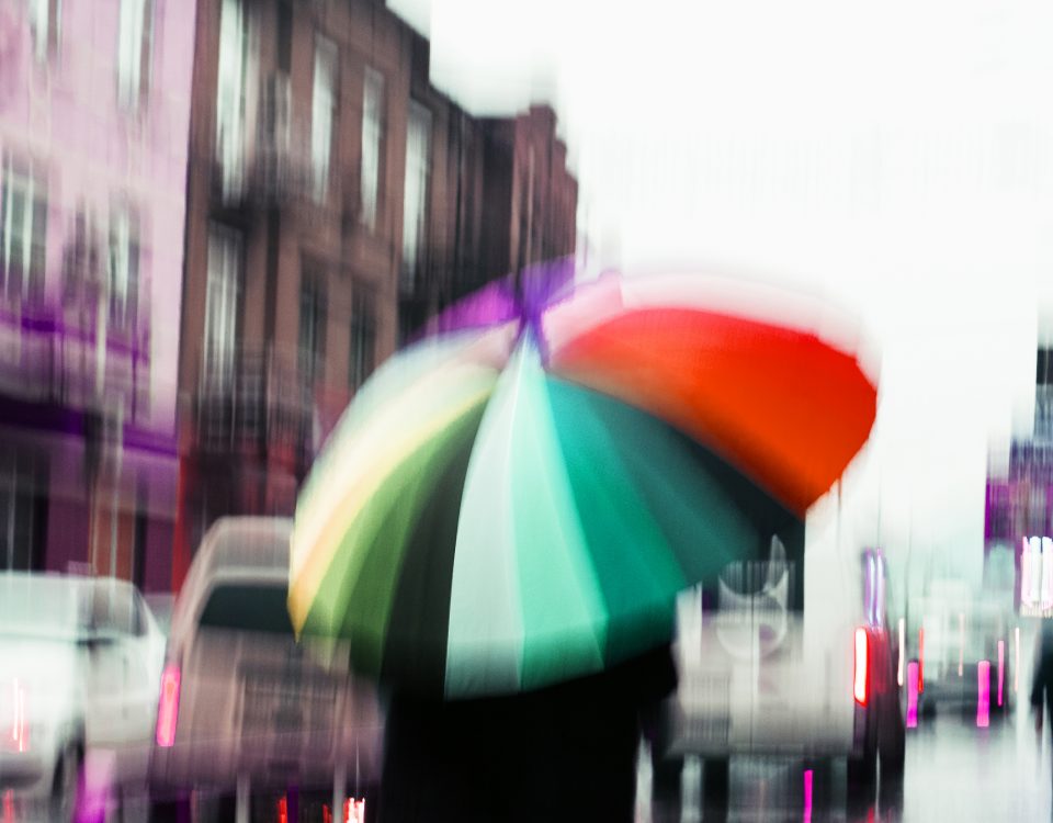 street in a rainy day reflection blur umbrella