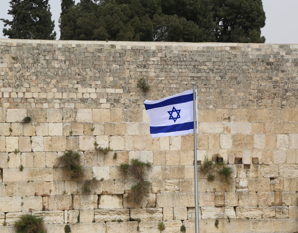 Israeli Flag in front of the Western Wall in the Old City of Jerusalem.