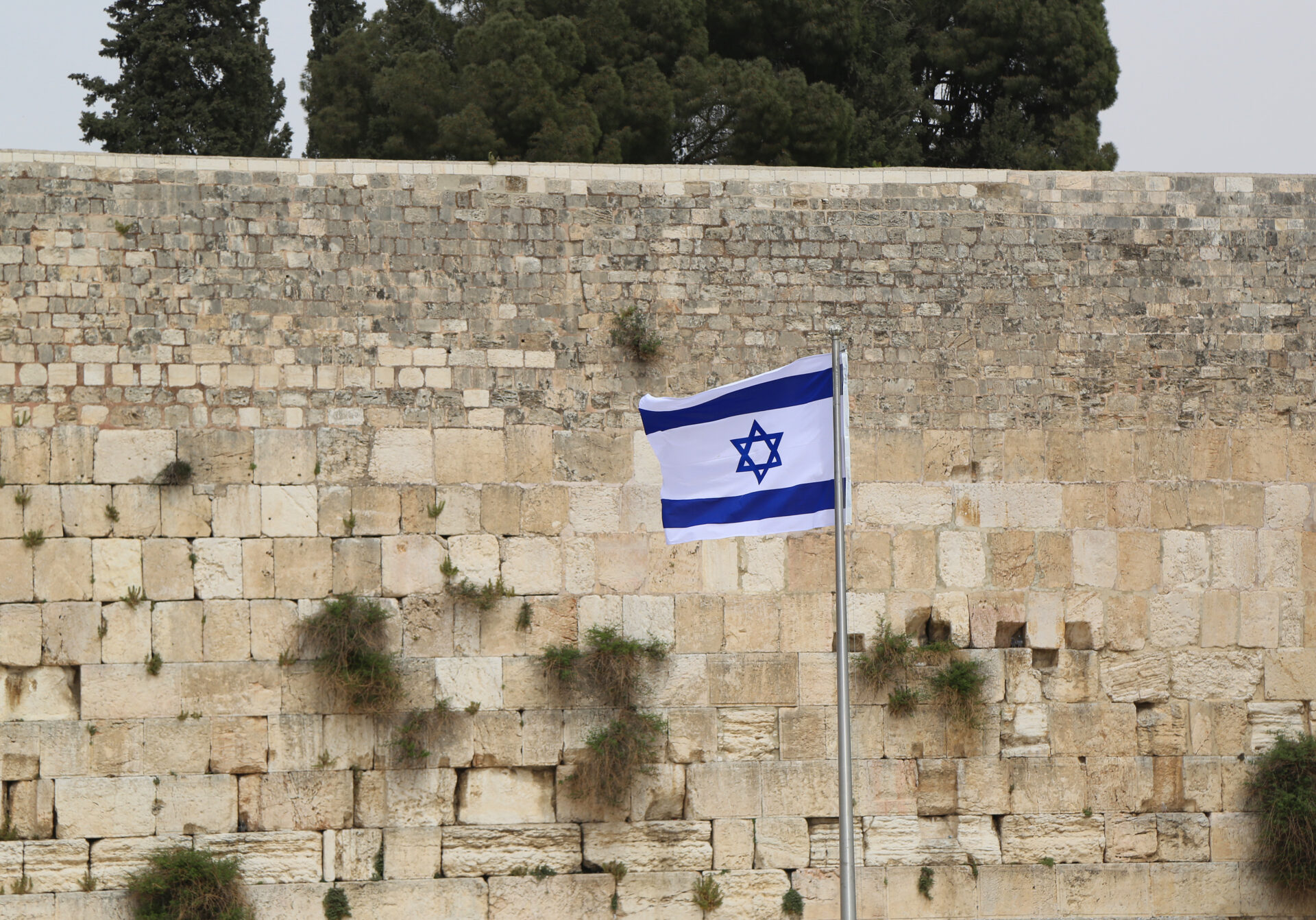 Israeli Flag in front of the Western Wall in the Old City of Jerusalem.